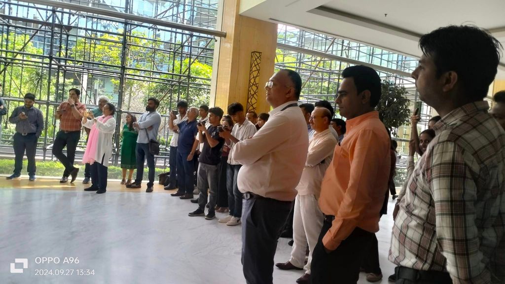 A captivated audience of students, teachers, and community members watching the street play about cleanliness and sustainable practices